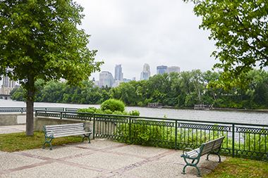 Downtown Minneapolis and riverfront views with benches