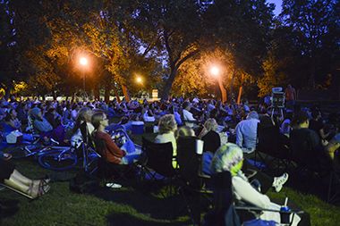 Audience Seated on the Grass for Movies in the Parks