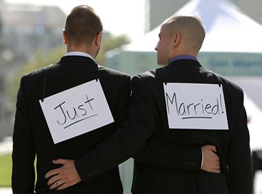 Just Married Signs on Backs of Grooms at Minneapolis Sculpture Garden