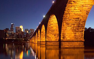 Stone Arch Bridge Lit at Night on Special Occasions
