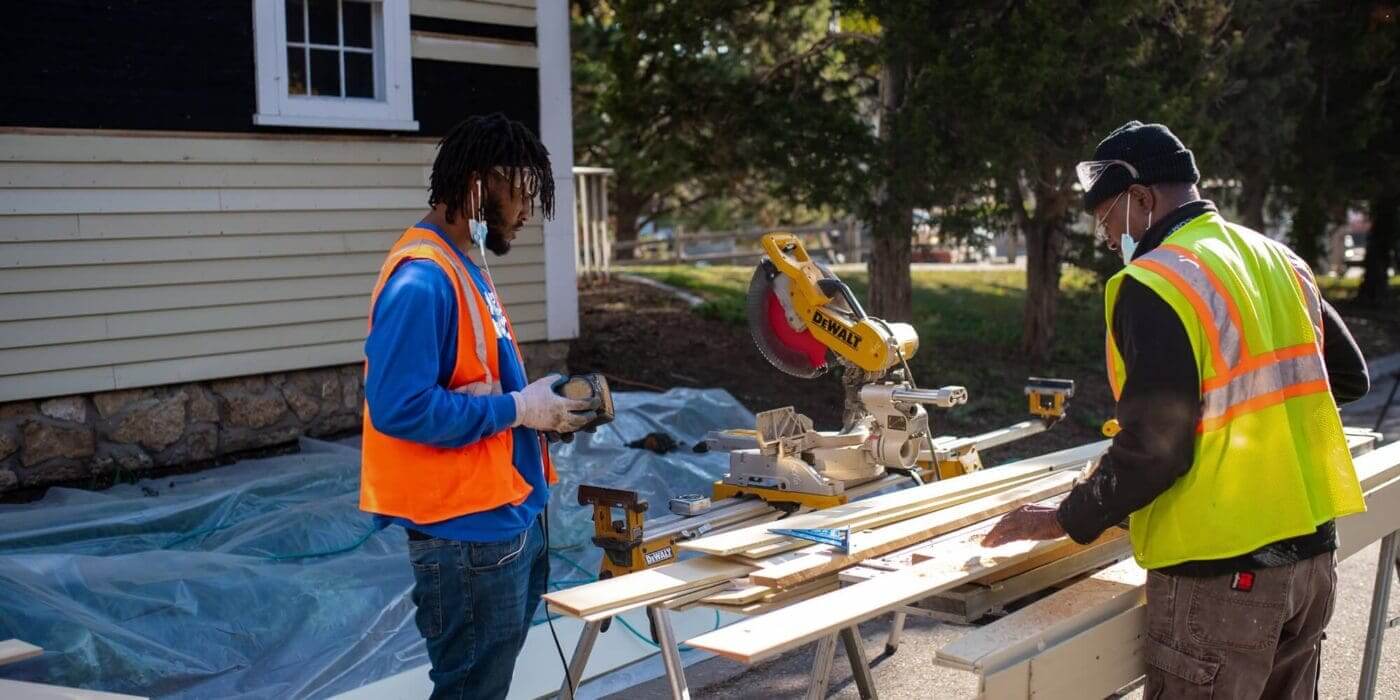 Hennepin county carpenters and apprentices perform maintenance on the Ard Godfrey House in Northeast Minneapolis