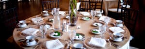 a round table is set for a wedding
