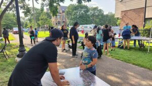 Community members engaging with park staff and designs at kickoff party