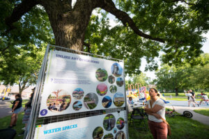 Community member viewing a design sign at an open house