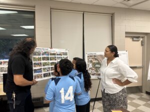 Community members engaging with park designs during a focus group session.