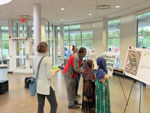 Community members engaging with park designs at an open house