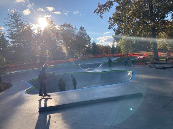 People skateboarding at Folwell skate park.