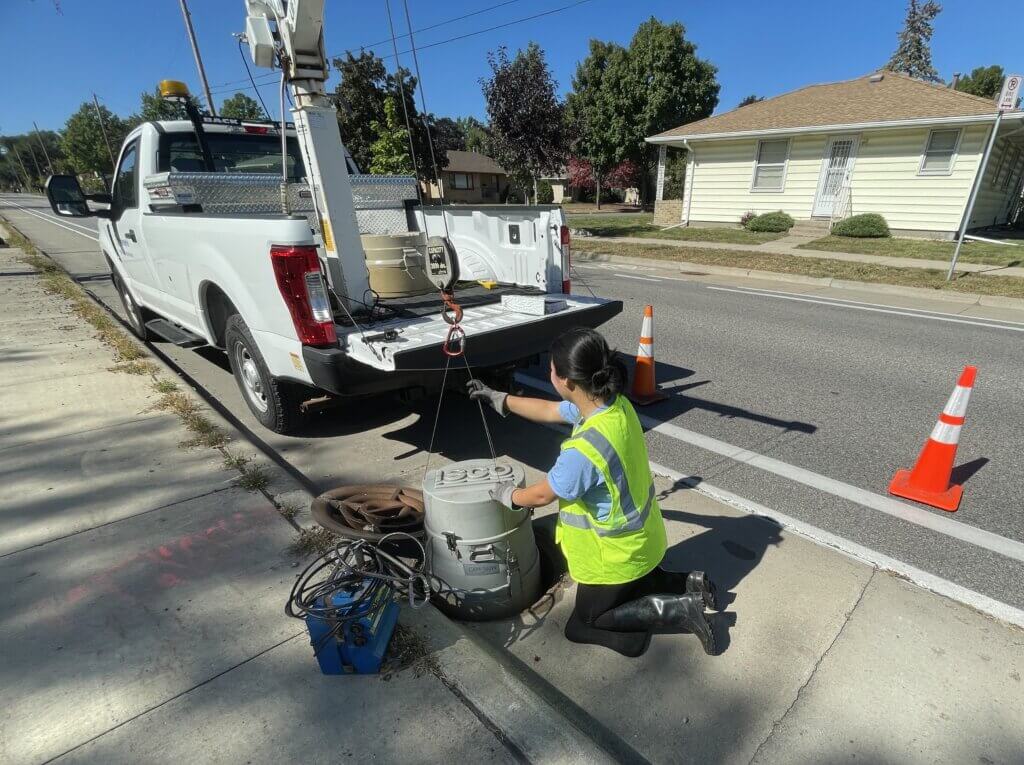 sewer workers near truck