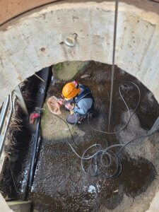 Sewer worker working in sewer