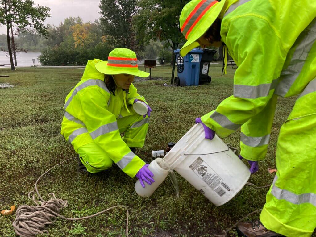 workers collecting and testing stormwater