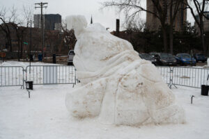 Back of snow sculpture, snapping turtle with a fish in its mouth. 