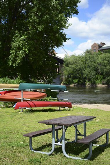 Canoe and kayak racks near picnic table