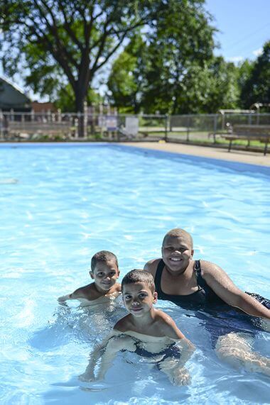 family in wading pool