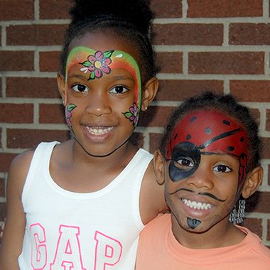two kids with their faces painted