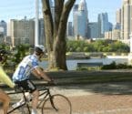 banner image: Bicyclists on Main Street looking at river