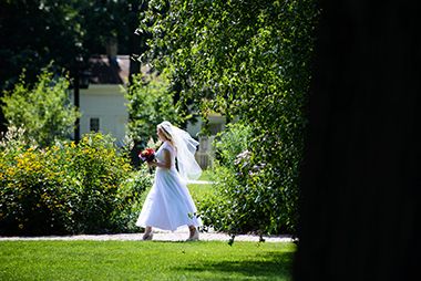 Bride Walking at the Minnehaha Falls Pergola Garden