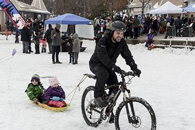 Biker in the Snow at Lake Harriet Winter Kite Festival