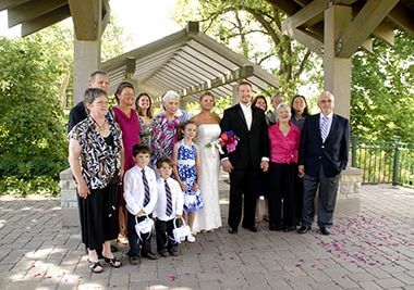 Family Smiles with Bride and Groom at the Minnehaha Falls Pergola Garden
