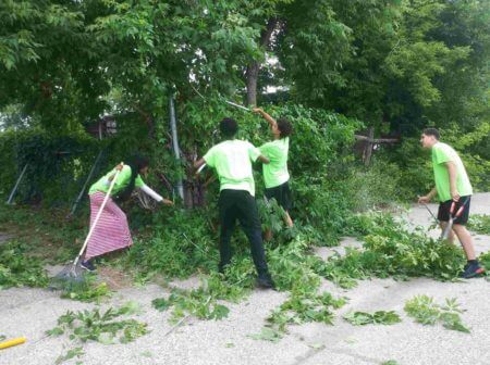 Teen Teamworks members doing yard work.