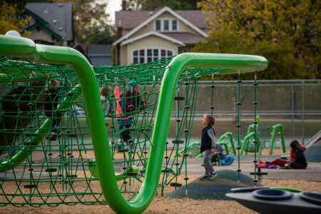 Children play on the newly opened Phelps playground in South Minneapolis