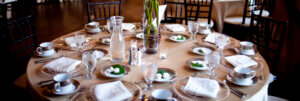 a round table is set for a wedding